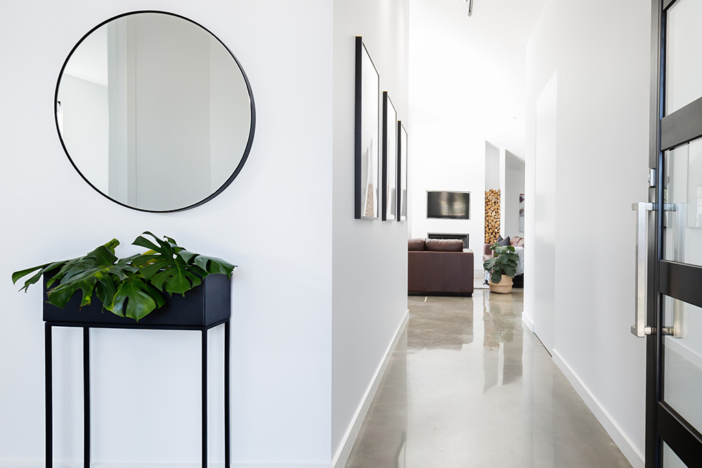 Hallway with mirror and artwork hanging