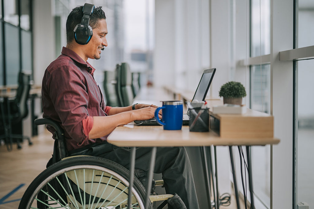 Man in a wheelchair on a virtual meeting