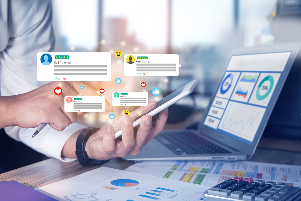 Someone holding a phone looking at reviews on social media
