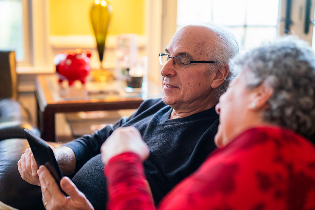 Older couple looking at tablet