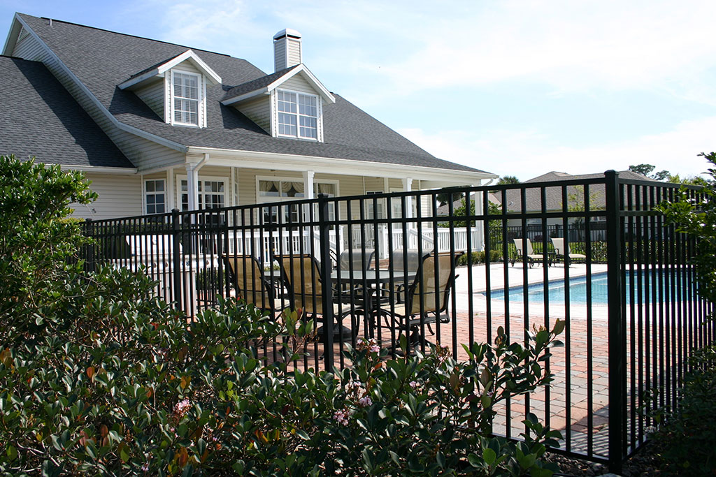 Fenced in backyard with pool