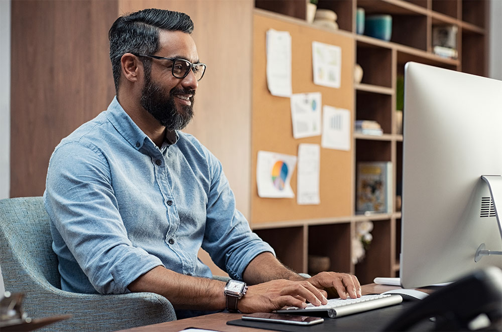 Man working on computer at desk