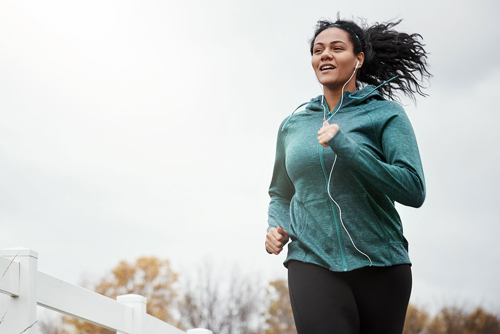 Woman running with headphones on