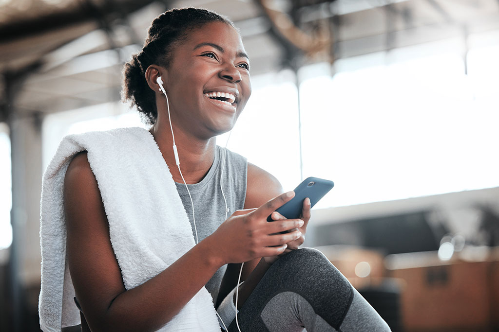 Woman working out listening to podcast