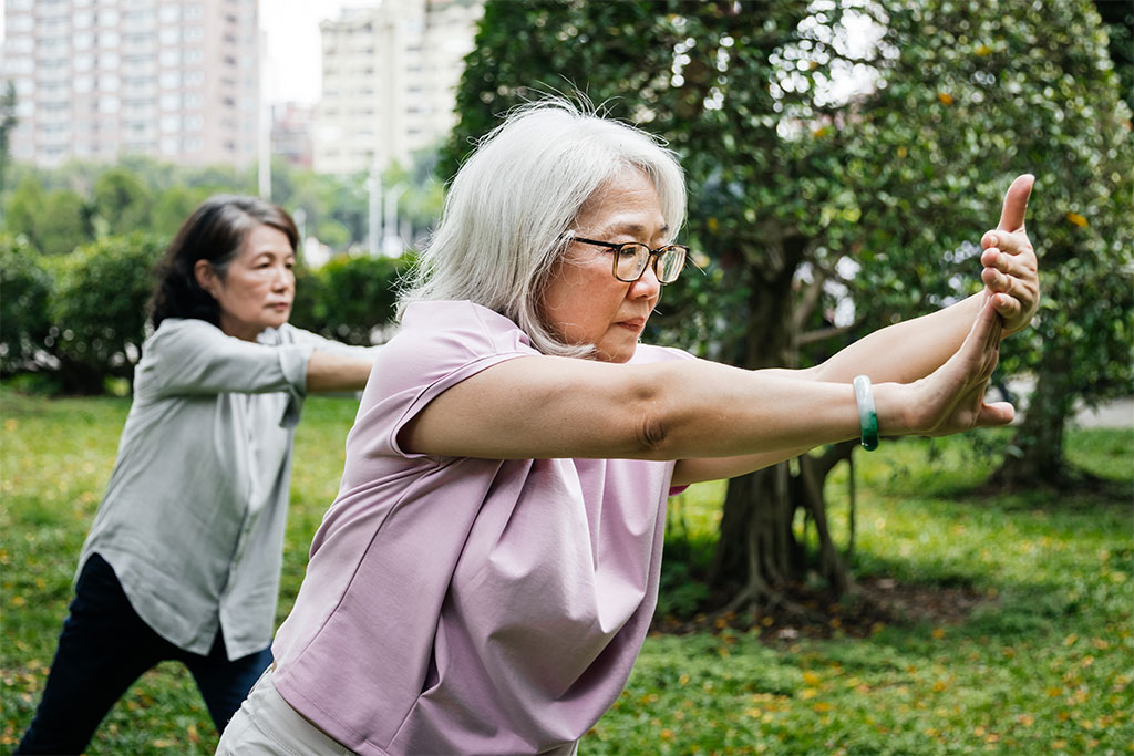 Older woman doing tai chi