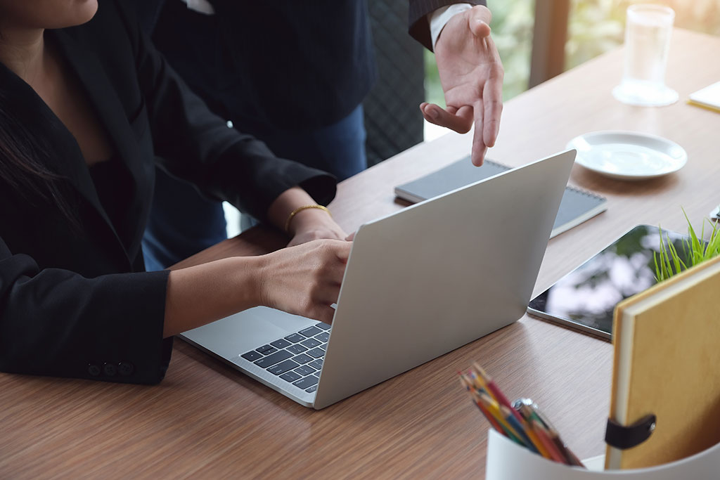 Business woman looking using laptop