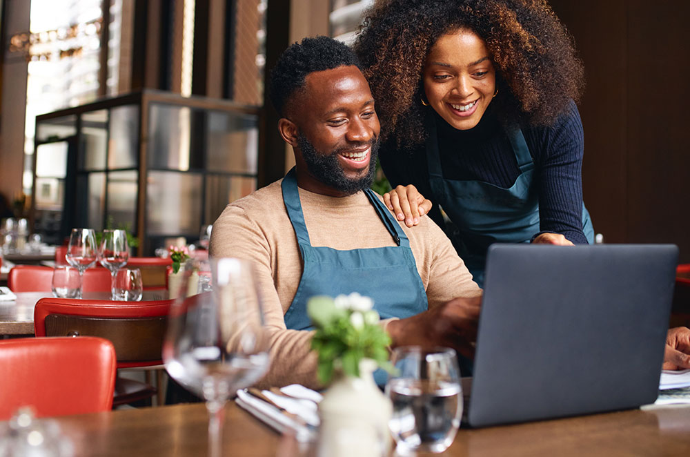 Business owners looking at laptop