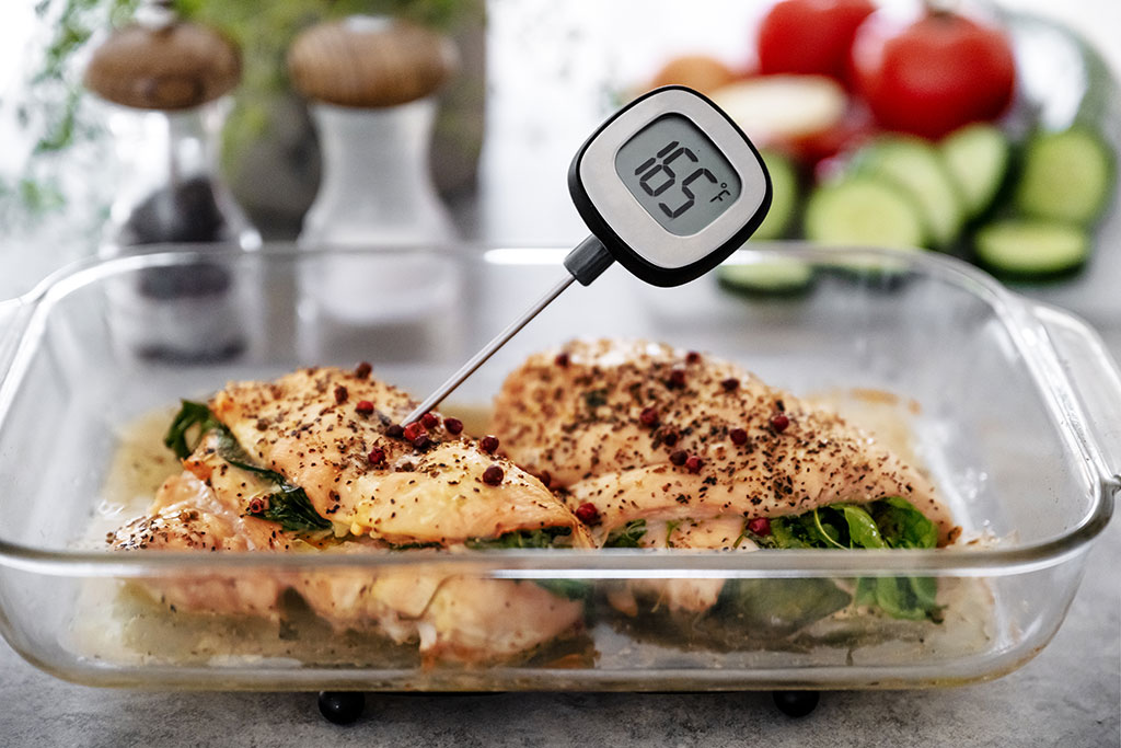 Cooked chicken with meat thermometer