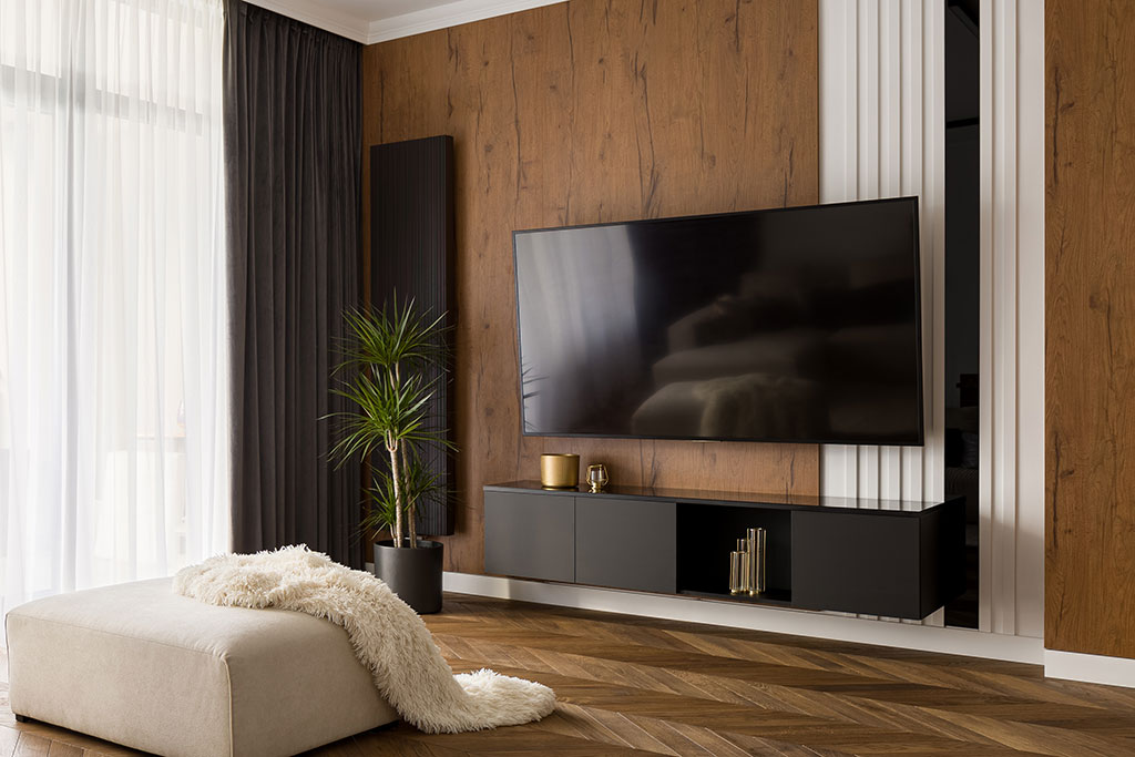 Modern living room with T.V. mounted to wall