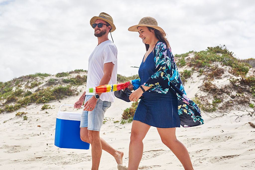 Couple walking towards beach