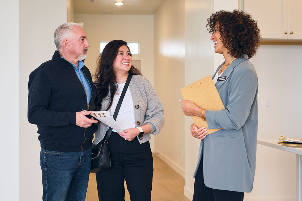 Couple talking with realtor