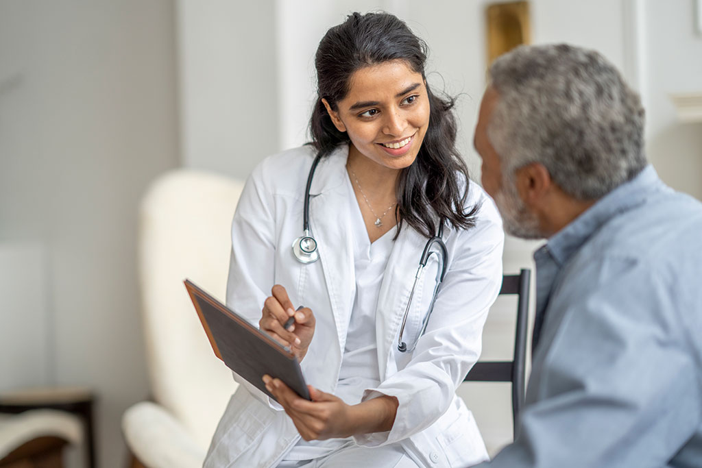 Physician associate talking with patient