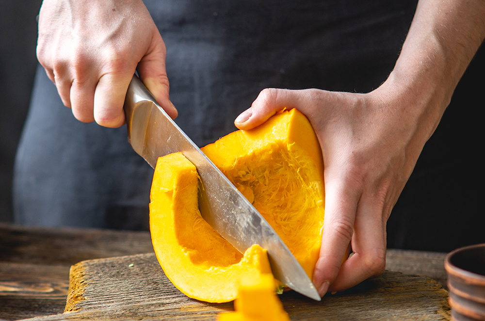 Cutting pumpkin with a knife