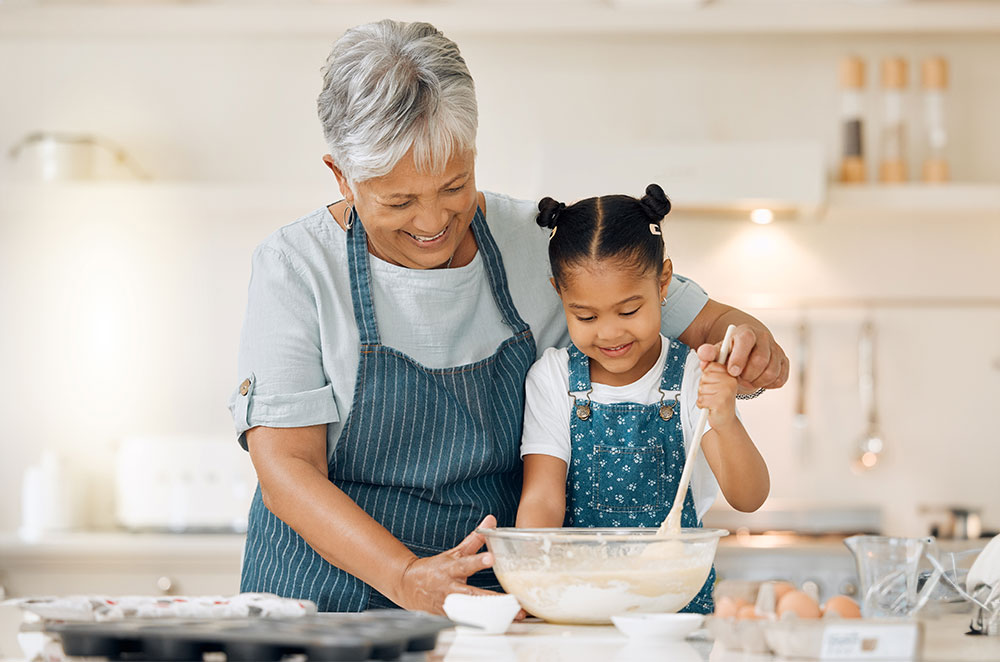 Grandmother and granddaughter baking