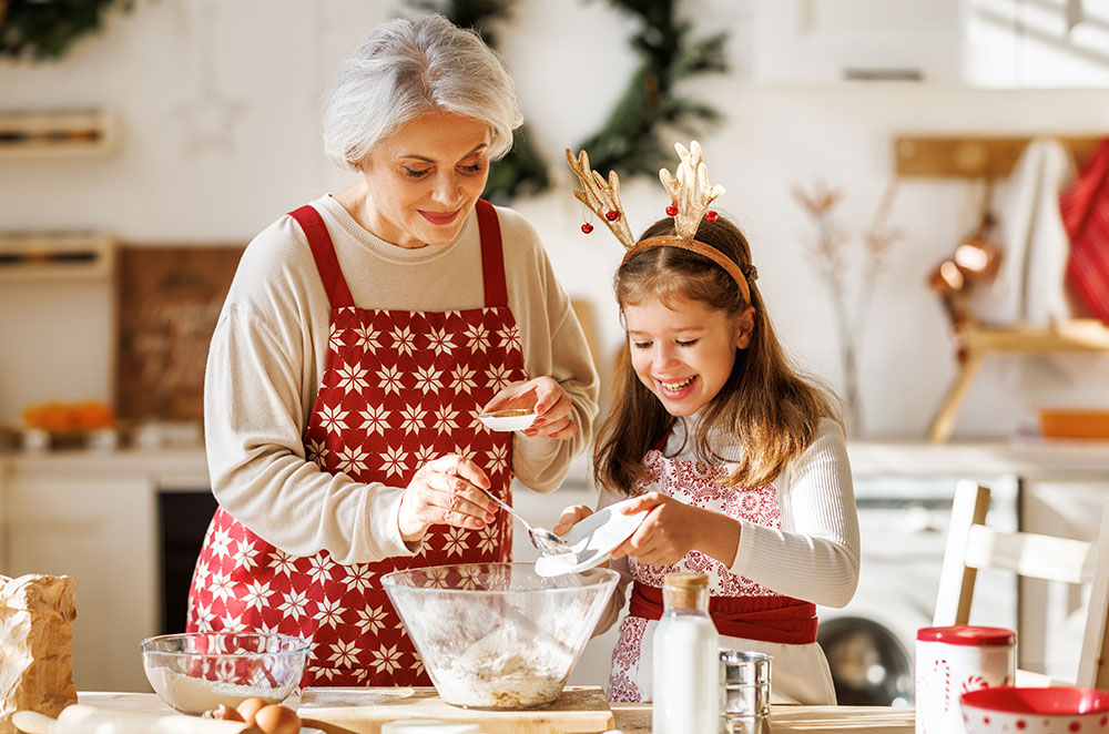 Grandma and granddaughter baking