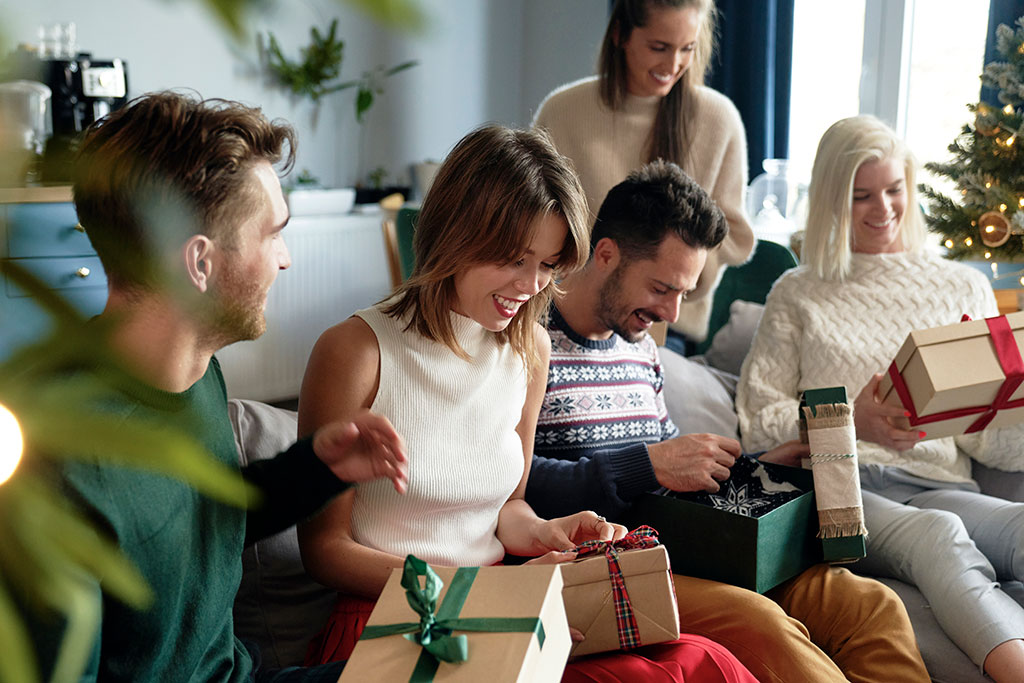 Friends opening Christmas presents