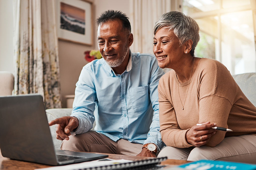 Older couple looking at laptop