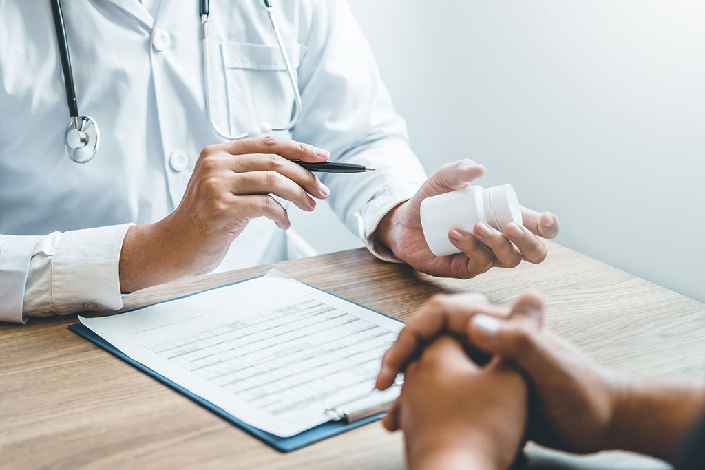 Doctor discussing medication with patient