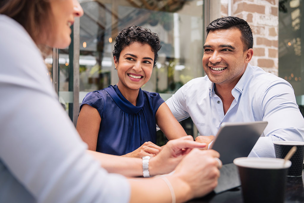 Couple talking with advisor