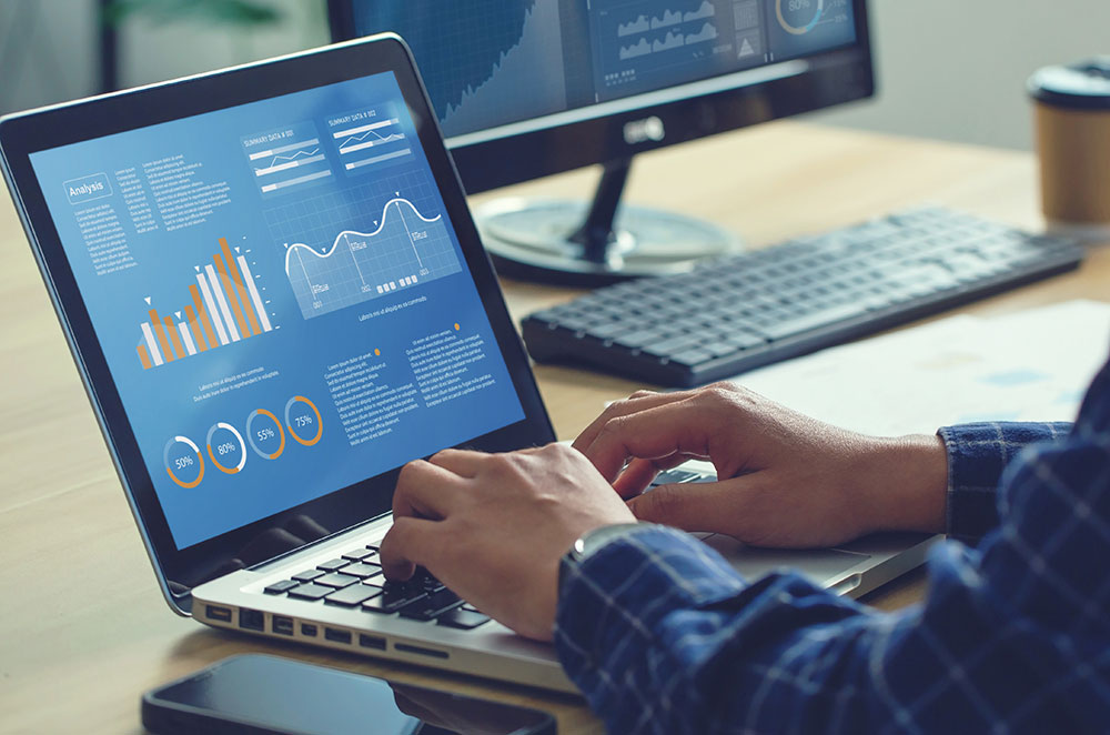 Man looking at analytics on computer