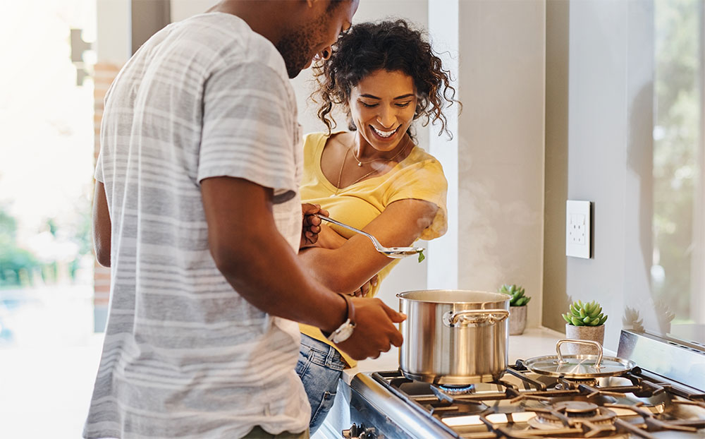 Couple cooking dinner