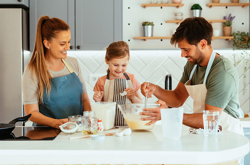 Family baking in kitchen together