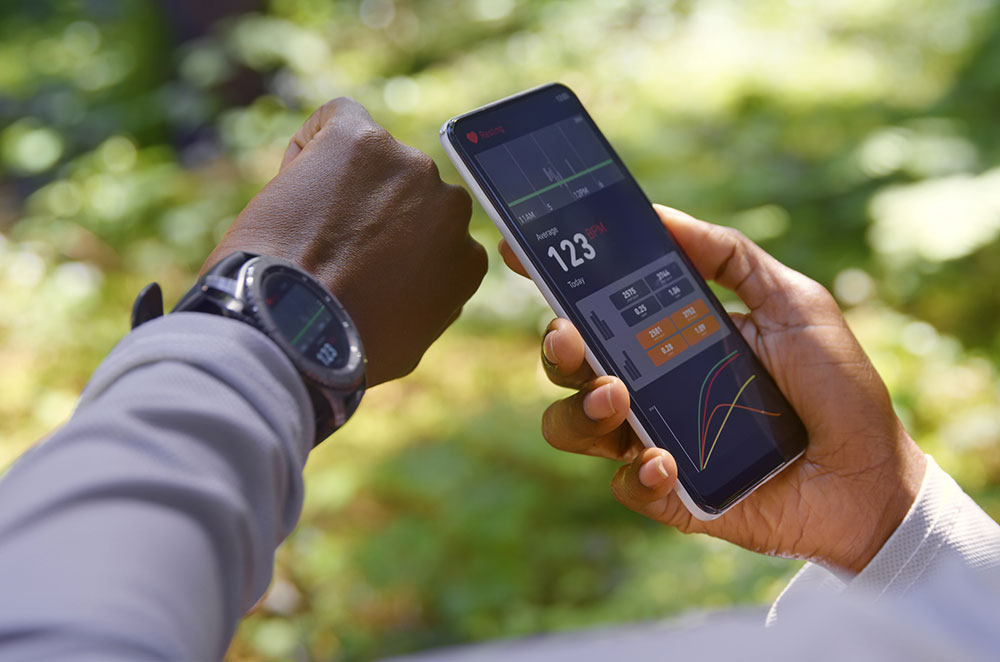 Person looking at heart monitor connected to exercise watch