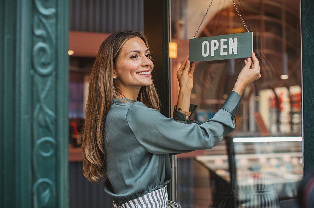 Small business owner opening shop