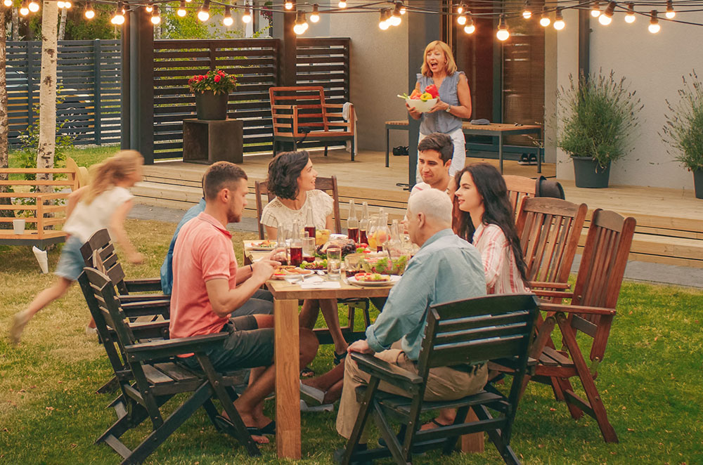 People eating in backyard