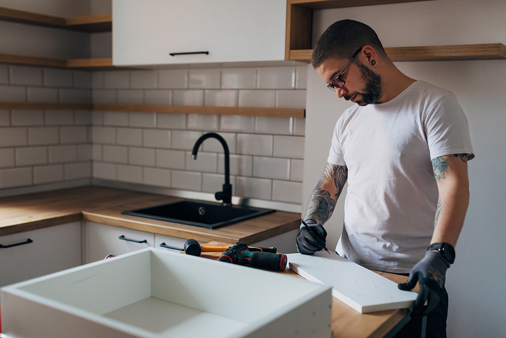 Man remodeling kitchen