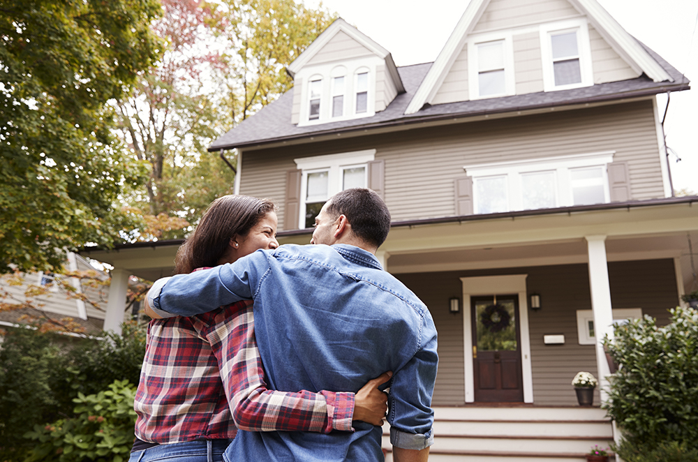 Rear View Of Loving Couple Walking Towards House