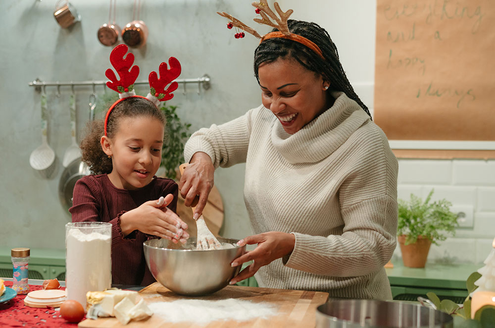 Mom and daughter baking Christmas dessert