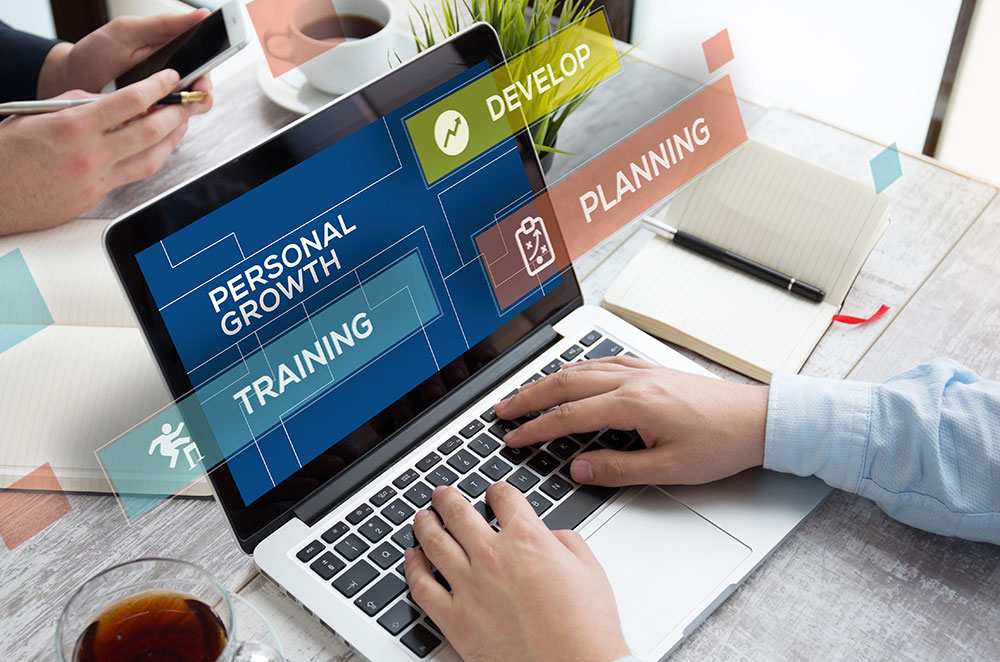 Business graphics above laptop