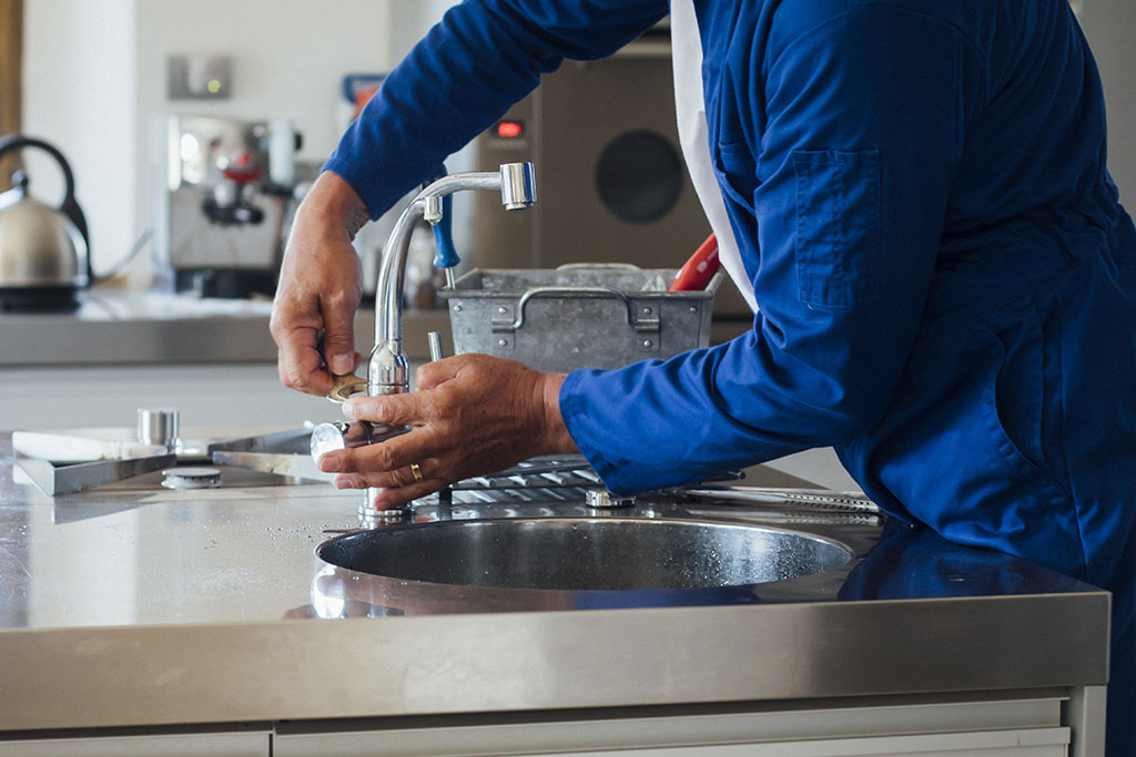 Man fixing sink