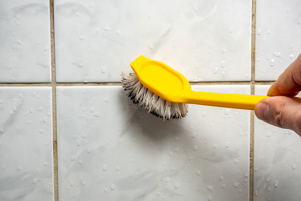 Cleaning backsplash with toothbrush
