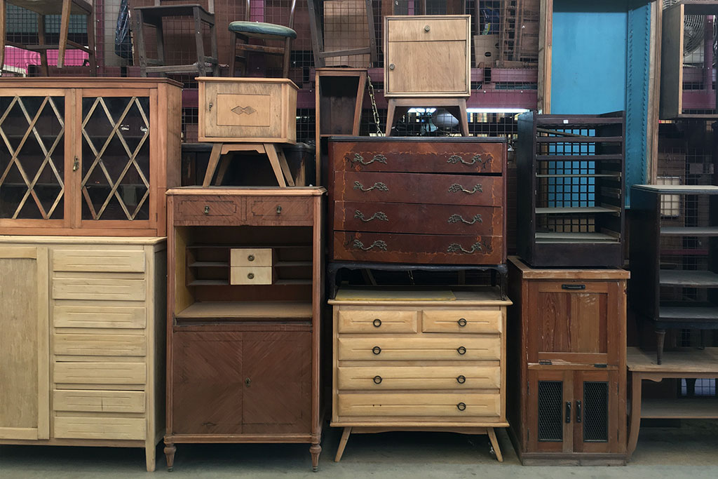 Older dressers stacked on top of each other